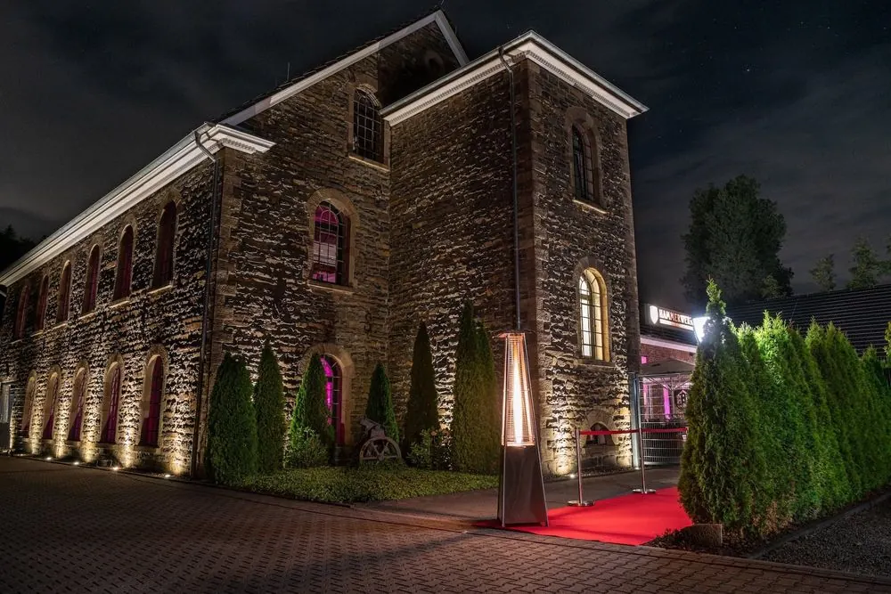 Event Venue 2 – Historic event venue: stone facade at night, ballroom, bar and lightin