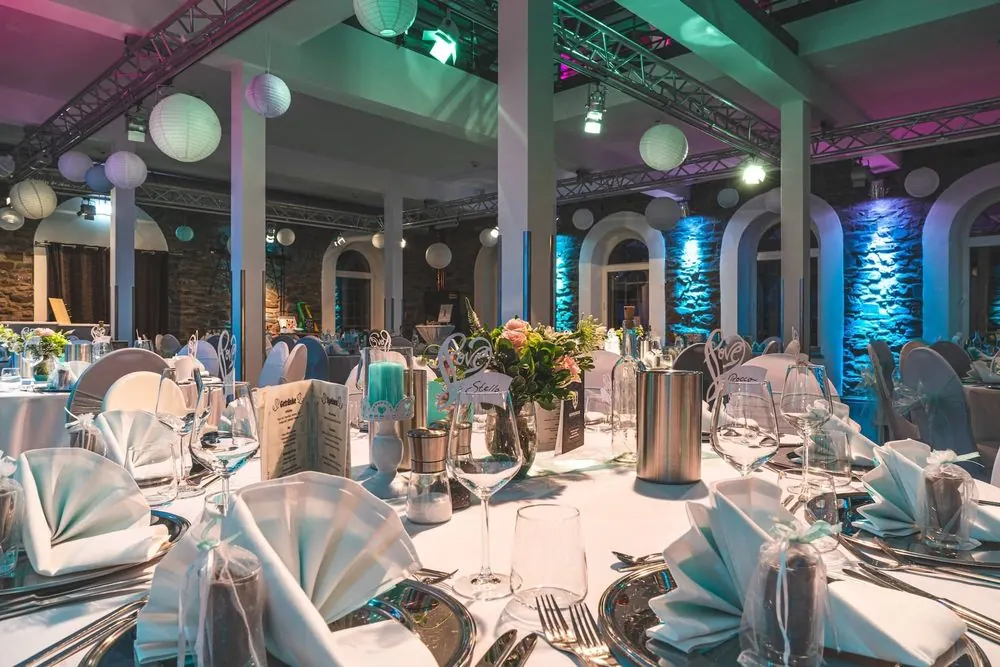 Event Venue 4 – Historic event venue: stone facade at night, ballroom, bar and lightin