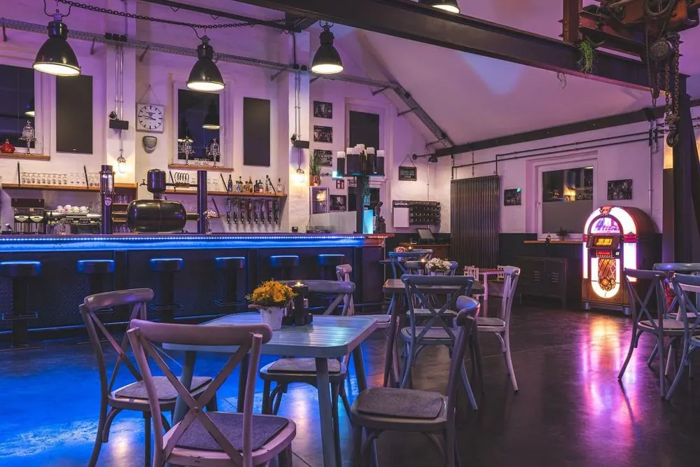 Event Venue 6 – Historic event venue: stone facade at night, ballroom, bar and lightin
