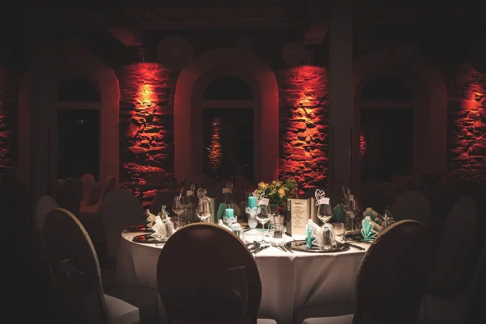 Event Venue 11 – Historic event venue: stone facade at night, ballroom, bar and lightin
