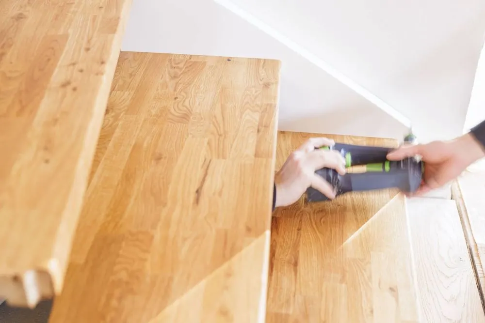 Staircase Construction 2 – Craft photography: installation of a wooden staircase in motion.